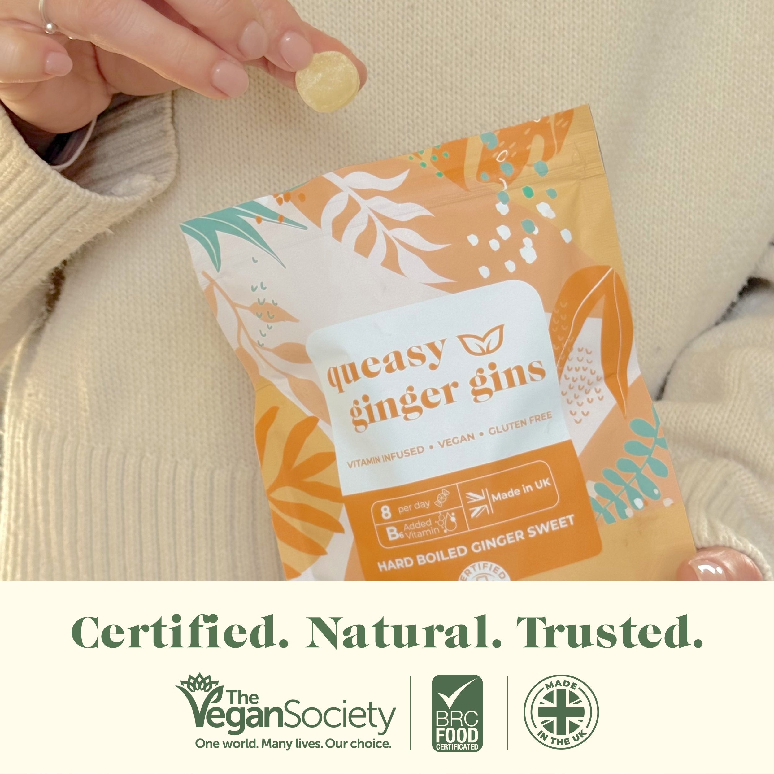 Person holding Myrtle & Maude queasy ginger gins - certified by Vegan Society and Pro Food, made in UK morning sickness nausea relief sweet